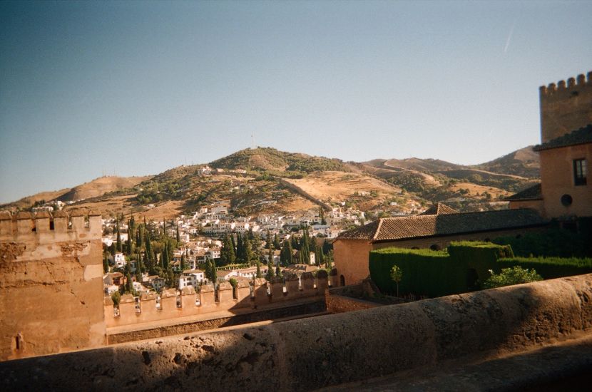 A cliff side in Granada, Spain. A clear blue sky overlooking the Alhambra. 